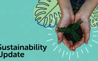 Hands holding a small plant with soil over a green background with leaf illustrations. "Sustainability Update" is written on the left side, highlighting our Sustainable Campus Initiative.