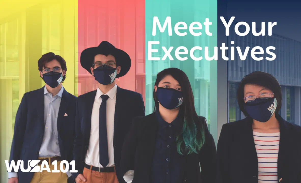 Four individuals wearing face masks and business attire stand side by side against a colorful, vertically striped background with the text "Meet Your Executives" and the logo "WUSA 101" displayed.