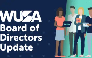 An illustrated image shows four diverse individuals in business attire standing next to the text "WUSA Board Update." Two individuals are holding tablets displaying the WUSA logo. The background features a gradient design in teal and dark blue.