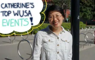 A person wearing glasses and a white button-up shirt is smiling outdoors. A cloud-shaped graphic near their head reads, "Catherine's Top WUSA Events!" in dark blue and light blue text, with a park and bike racks visible in the background, highlighting key WUSA events.