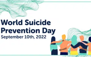 Students facing away from viewer with arms around each other | text: World Suicide Prevention Day
