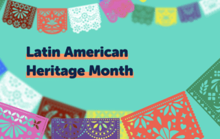 The image features colorful papel picado banners hanging across the top and bottom against a turquoise background. In the center, bold text reads "Latin American Heritage Month 2022" in dark blue with an orange shadow.