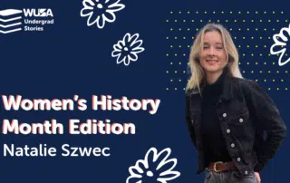 Against a navy blue backdrop adorned with white floral designs and small yellow dots, a young woman smiles with her hands in her pockets. The text reads, "WUSA Undergrad Stories: Women’s History Month Edition: Natalie Swec.