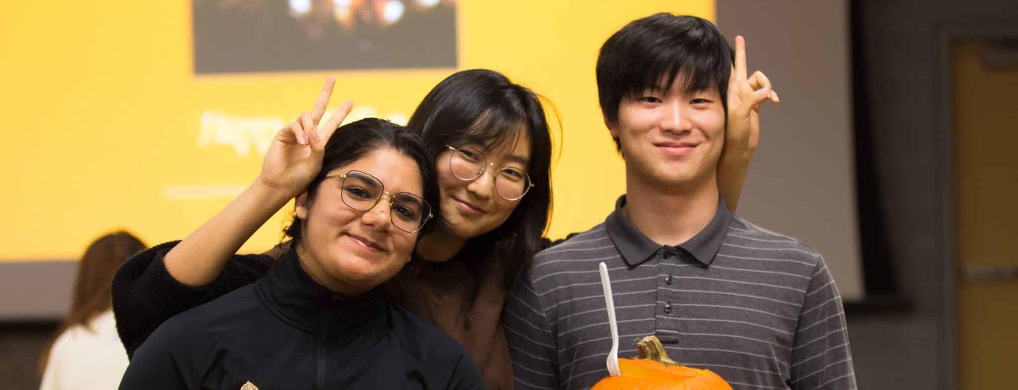 Students at the International Canadian Student Network (ICSN) organized Halloween pumpkin carving event.