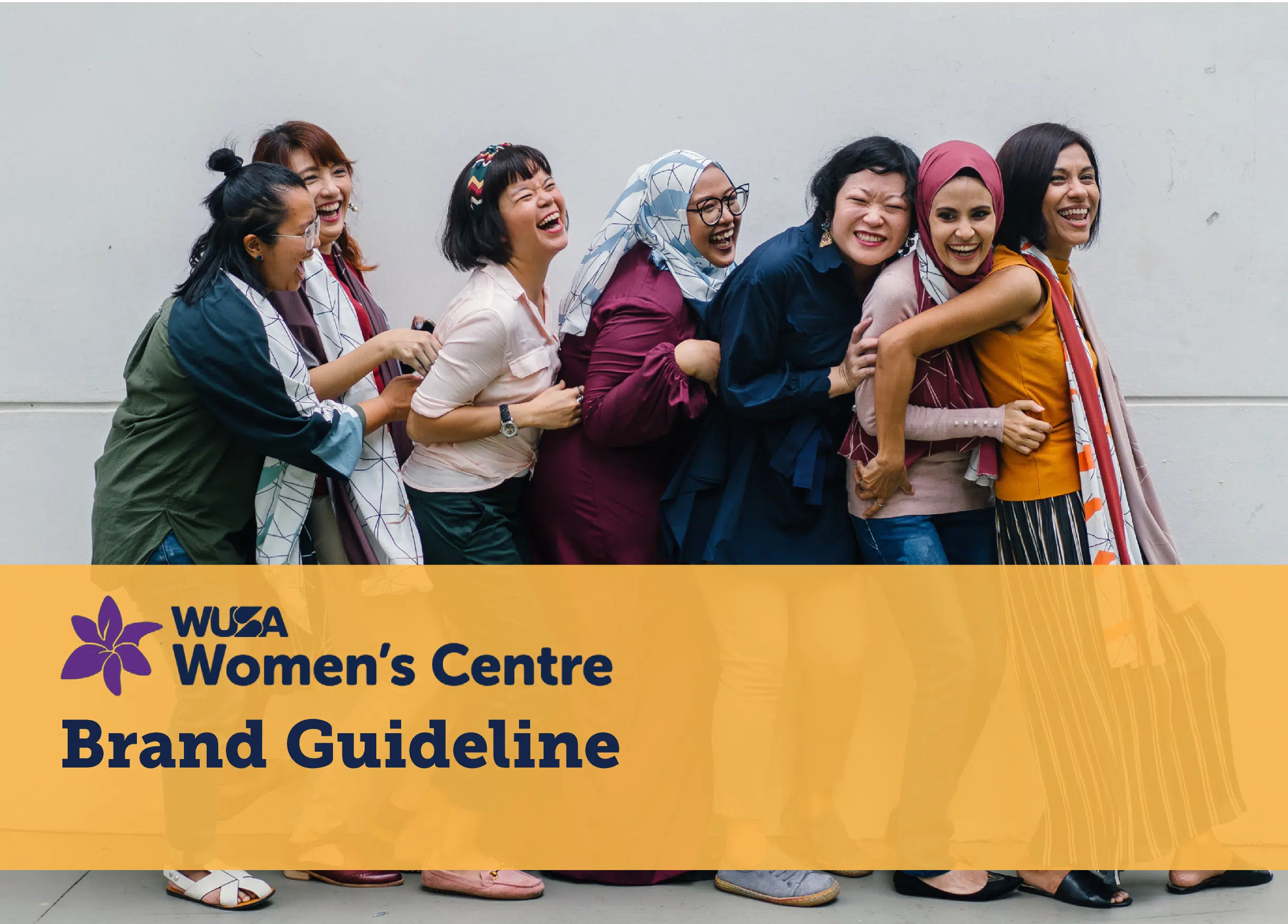 A diverse group of seven women stand close together, laughing and holding each other in a playful manner. They are in front of a plain wall. The image has the text “WUSA Women’s Centre Brand Guideline” at the bottom, with a purple flower logo to the left.