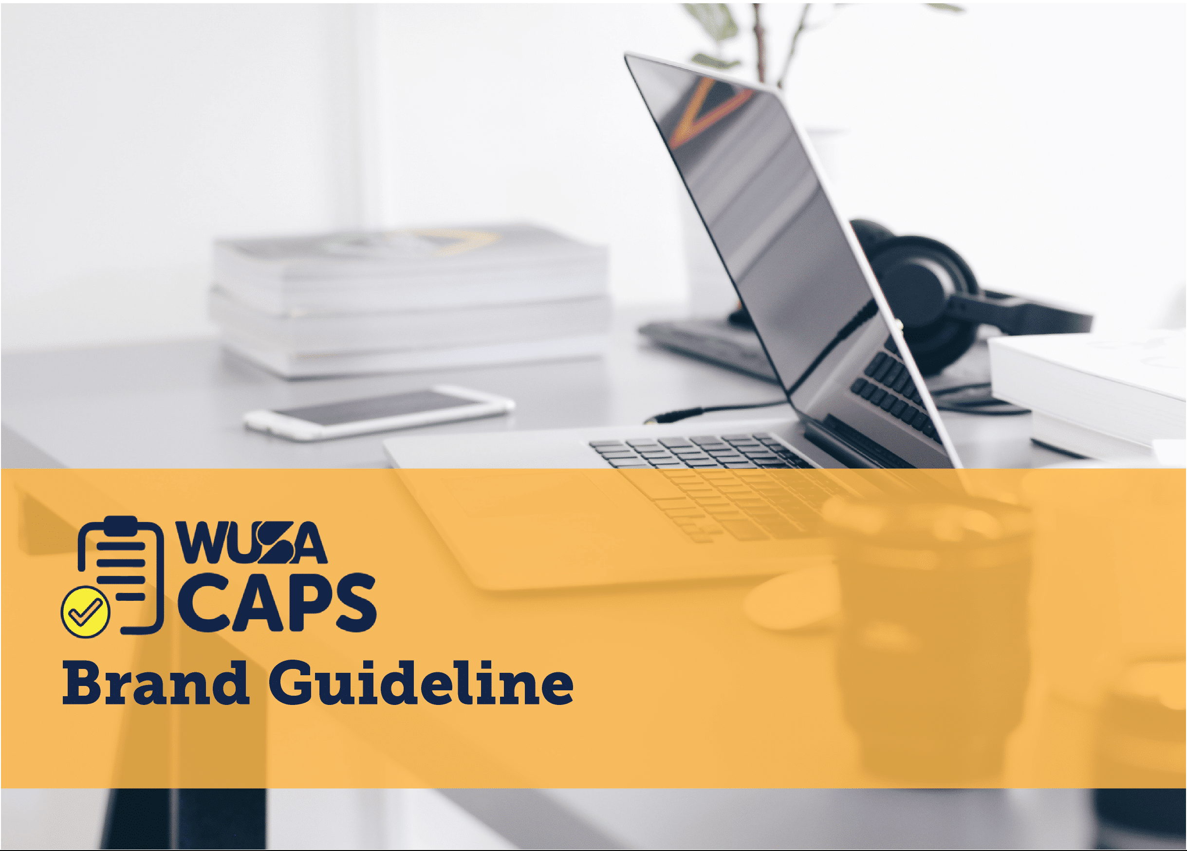 A laptop on a desk with other office supplies in the background. Overlaid on the image is a yellow banner with the text, "WUSA CAPS Brand Guideline," along with a logo depicting a checklist with a checkmark.