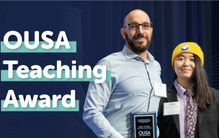 Two individuals are standing side by side. The person on the left is holding an award plaque that reads "OUSA Teaching Award 2023" and both are wearing name tags. The background features dark blue curtains and text that says "OUSA Teaching Excellence Award.
