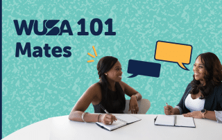 Two women are seated at a white table, engaged in conversation with notebooks in front of them. The background features a teal pattern with text reading "WUSA 101 MATES," accompanied by speech bubbles in orange and blue.