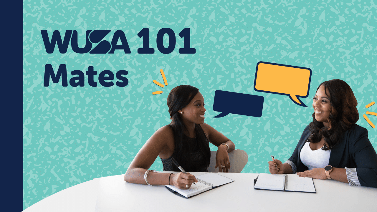 Two women are seated at a white table, engaged in conversation with notebooks in front of them. The background features a teal pattern with text reading "WUSA 101 MATES," accompanied by speech bubbles in orange and blue.