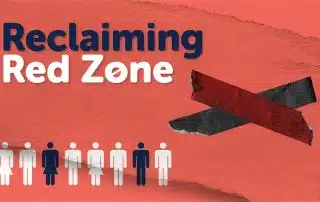 A graphic with the text "Reclaiming the Red Zone" on an orange-red, torn paper background. Below the text, there are white and dark blue silhouettes of people, with one person colored dark blue. A red and black tape in an 'X' shape appears on the right side.