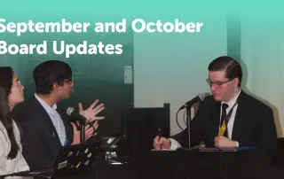 Three people in business attire are participating in a meeting. Two individuals on the left are speaking into microphones, while the person on the right is taking notes. Text at the top reads, "September and October Board Meeting Recap.