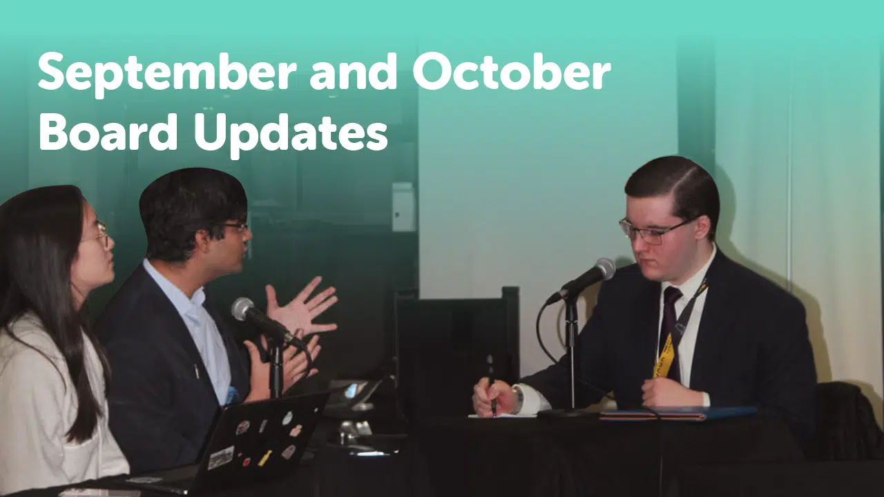 Three people in business attire are participating in a meeting. Two individuals on the left are speaking into microphones, while the person on the right is taking notes. Text at the top reads, "September and October Board Meeting Recap.