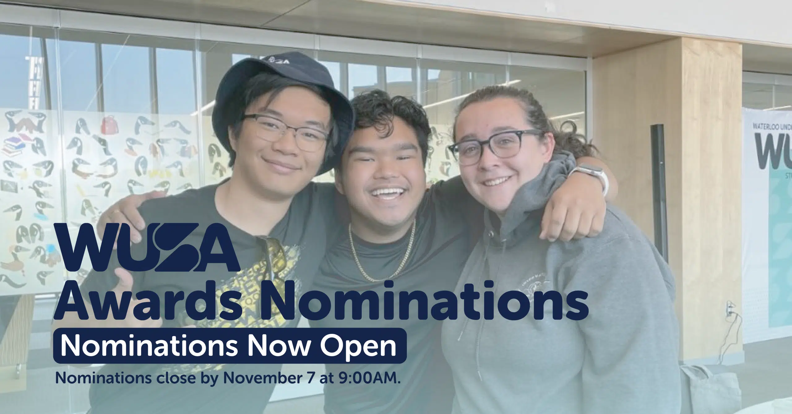 Three individuals are smiling and posing together indoors. The text overlay reads "WUSA Volunteer Awards Nominations" with a subheading "Nominations Now Open" and a note indicating that nominations close by November 7 at 9:00 AM.