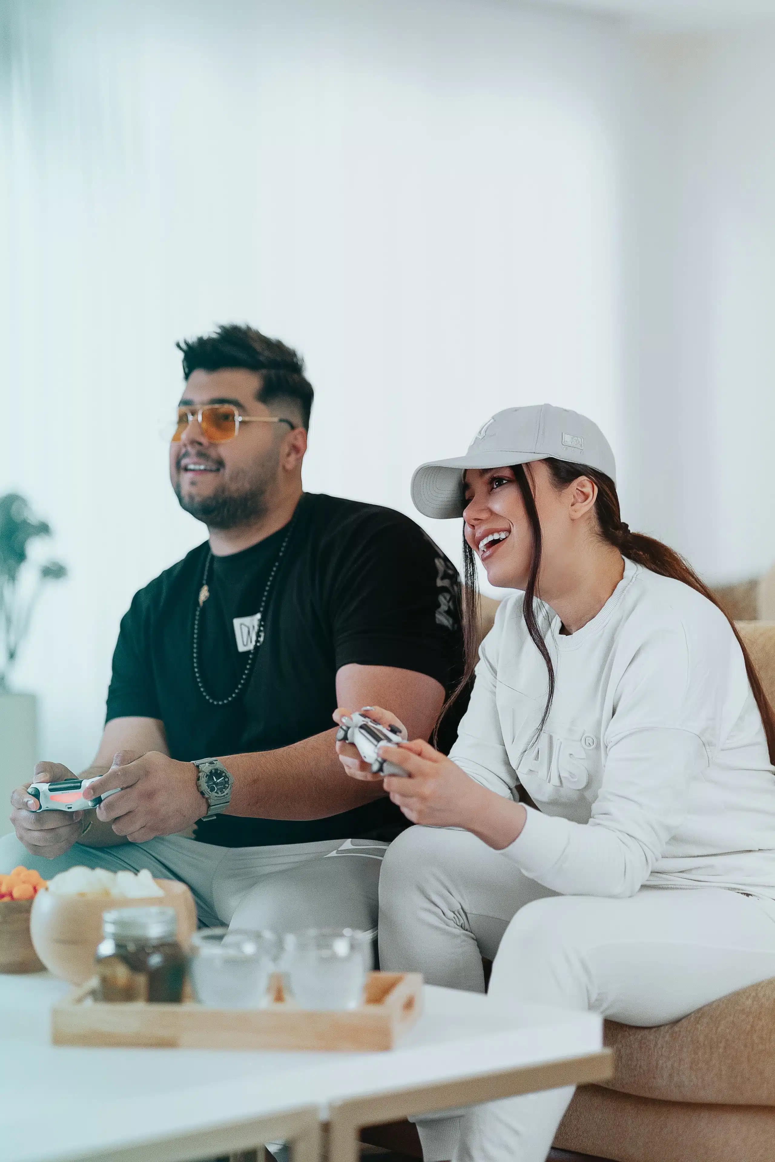 Two people playing with PS5 console.