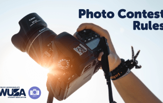 A person holding a professional camera against a bright, winter sky, with sunlight shining through the lens. Text on the right reads "Photo Contest Rules." Logos in the bottom left corner for Waterloo Undergraduate Student Association and the University of Waterloo Photography Club.