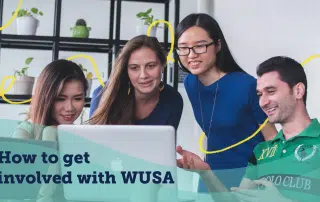 A diverse group of four young adults collaborates enthusiastically around a laptop in a modern office environment. The text overlay reads "How to get involved with WUSA." The background features shelves with potted plants and various items, hinting at the vibrant WUSA activities awaiting enthusiastic participation.