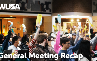 A large group of people hold up colored papers during an indoor meeting. Above them is the WUSA logo, and at the bottom, the text reads "2024 Annual General Meeting Recap." The attendees appear engaged and attentive.