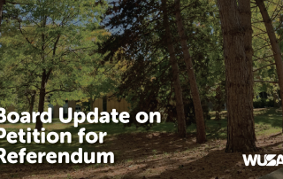 A wooded outdoor scene featuring large trees and dappled sunlight. Text overlays the image, stating "Board Update on Petition for Referendum." The WUSA logo is visible in the lower right corner.