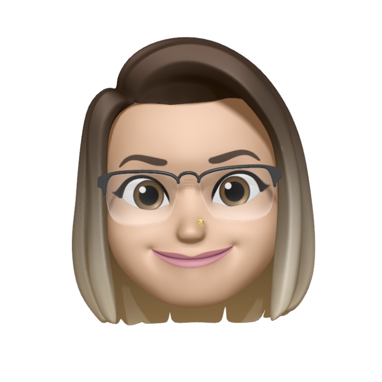 An emoji-style avatar with light brown hair, wearing transparent eyeglasses. The avatar has a nose piercing and is smiling with a closed mouth. The character has a fair complexion and expressive eyes.