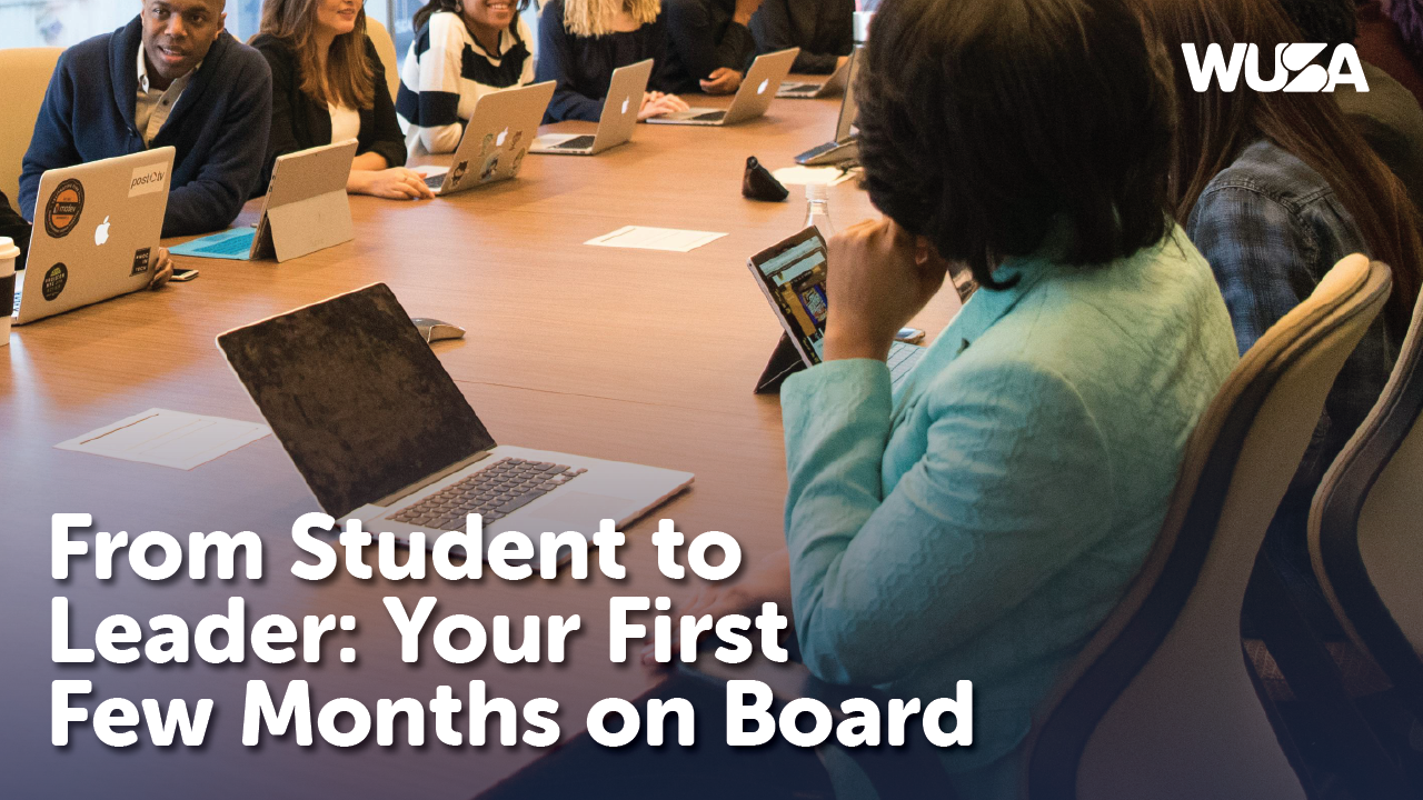 A group of diverse young adults in a meeting room, seated around a large table with laptops and notebooks, engaged in lively discussion. The image includes the text "From Student to Leader: Your First Few Months on Board" and the WUSA logo in the top right corner.