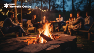 A cozy nighttime outdoor gathering around a campfire, reminiscent of Roosevelt's fireside chats, with a group of people sitting in a circle on chairs, enjoying the warm glow and ambiance. String lights are hung above, adding to the ambiance. The "WUSA Women's Centre" logo is in the top left corner.