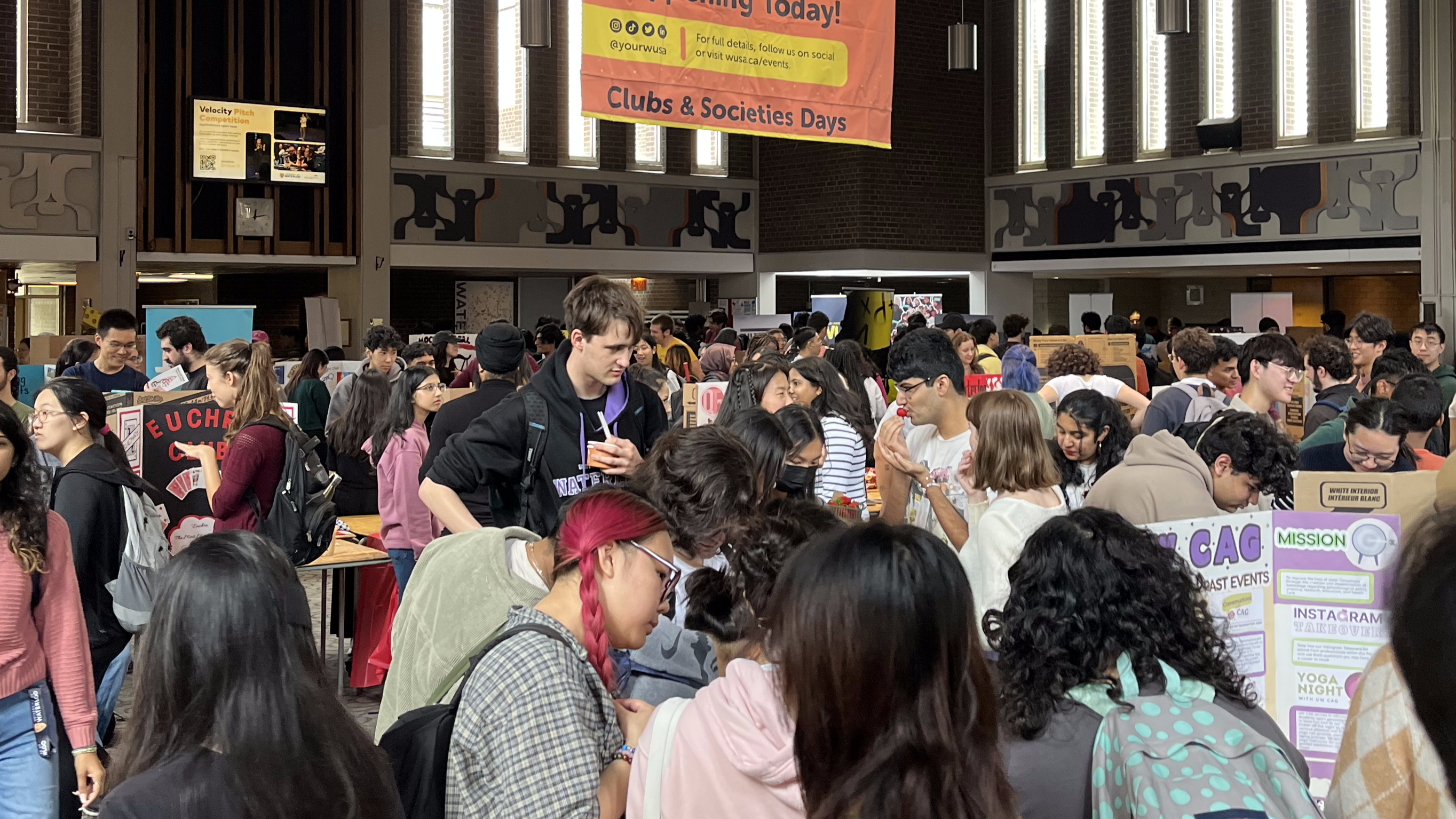 Students engaging with clubs in the SLC Great Hall