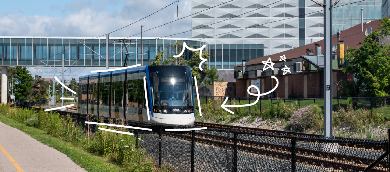 ION light rail on tracks beside Davis Centre Library