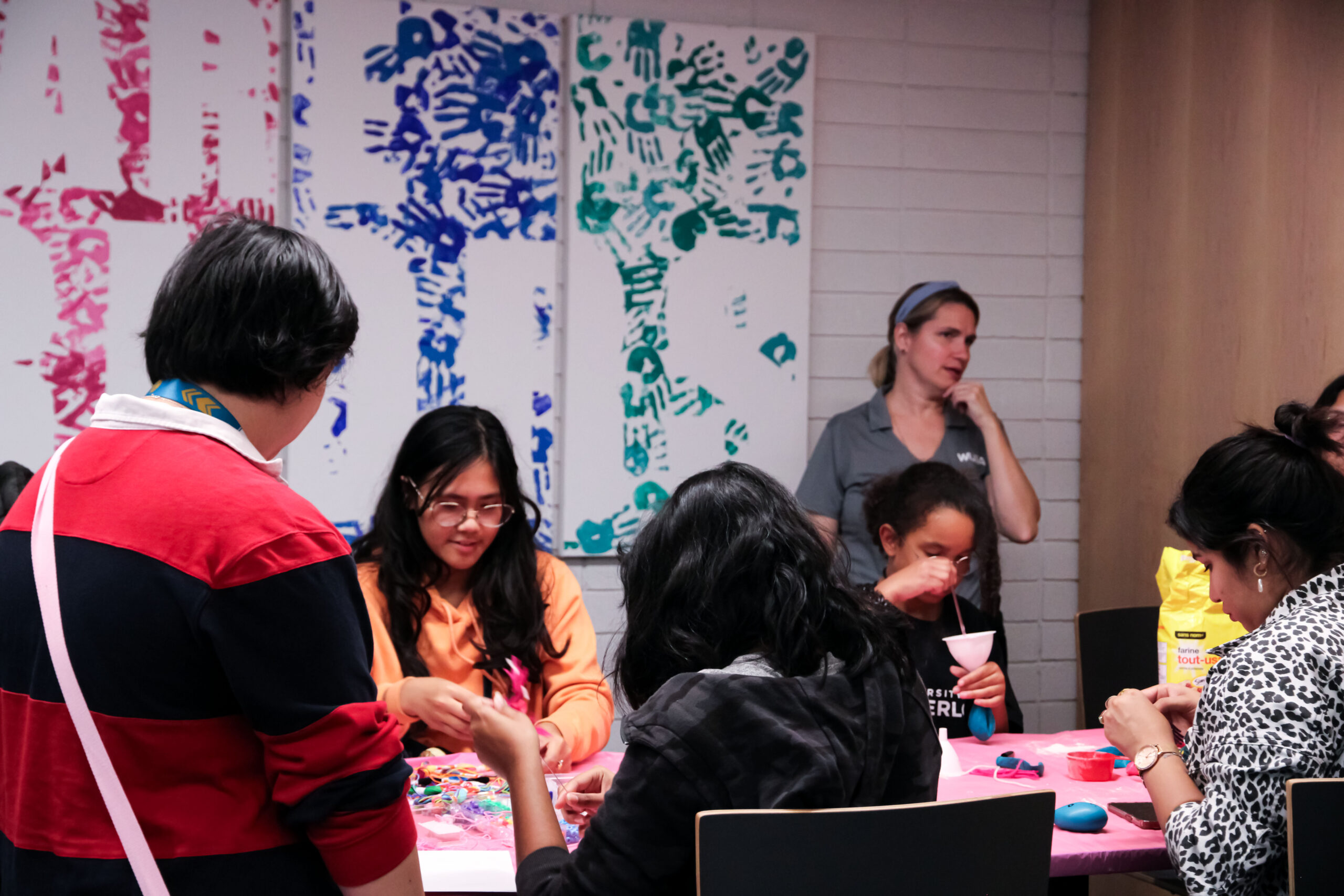 A group of people de-stressing while crafting.