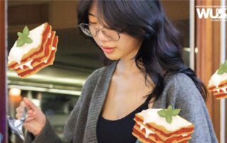 A woman with glasses serves food at a Lasagna Lunch, surrounded by cartoon lasagna illustrations and a WUSA logo in the corner at Stratford Campus.
