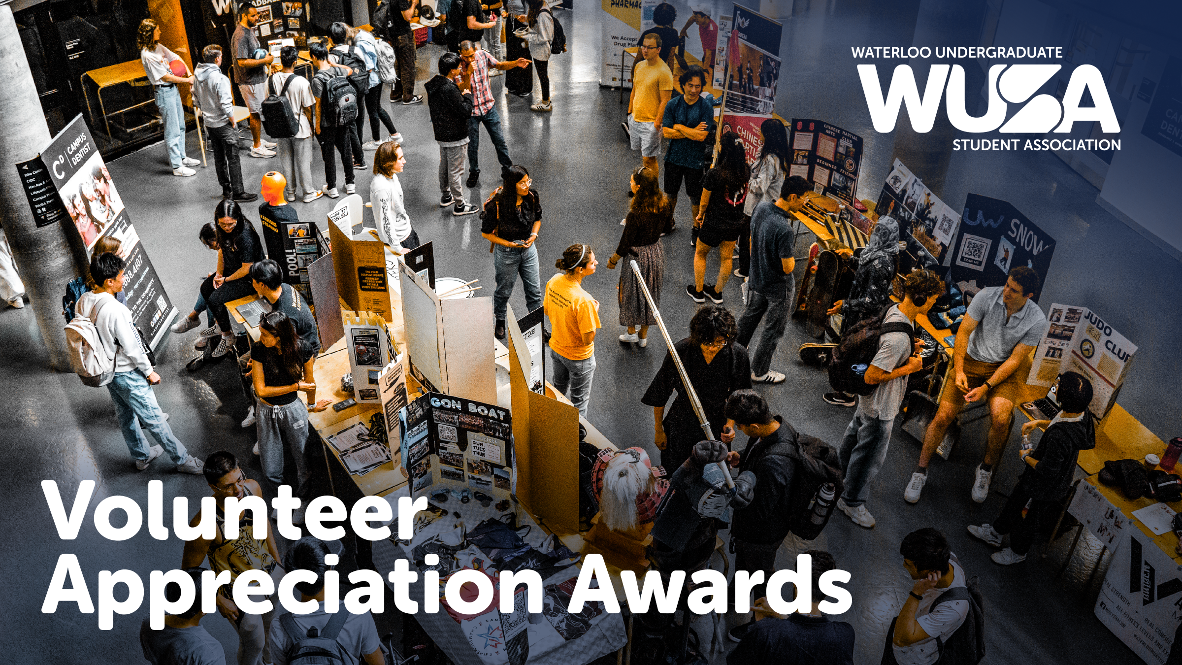 Volunteer Appreciation Awards Article Graphic Students gather around display tables at the WUSA Volunteer Awards, celebrating Student Excellence during Winter 2025.