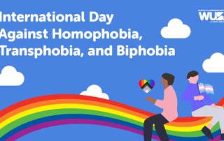 Two people sit on a rainbow with pride flags, honoring the International Day Against Homophobia, Transphobia, and Biphobia. Text reads “International Day Against Homophobia, Transphobia, and Biphobia.”.