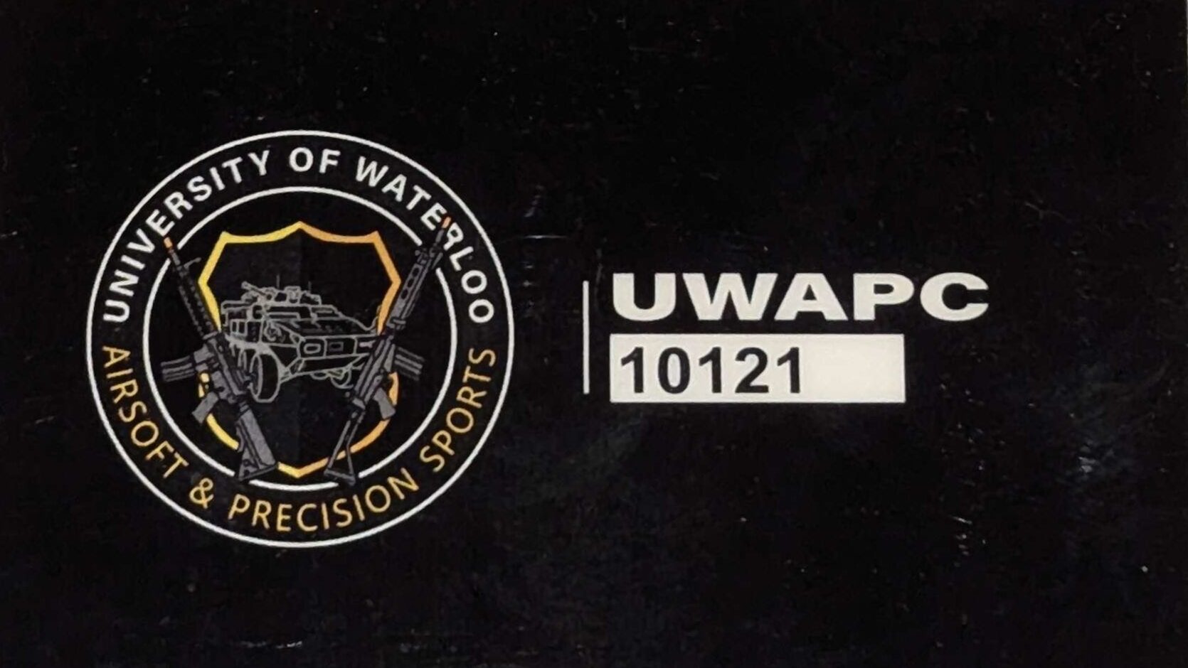 Black card featuring the UWAPC Club Standard logo of "University of Waterloo Airsoft & Precision Sports" and the text "UWAPC 10121".