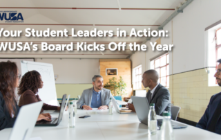 Five people sit around a table in a meeting room with "WUSA Board Kicks Off the Year" text above, highlighting Student Leadership in action.