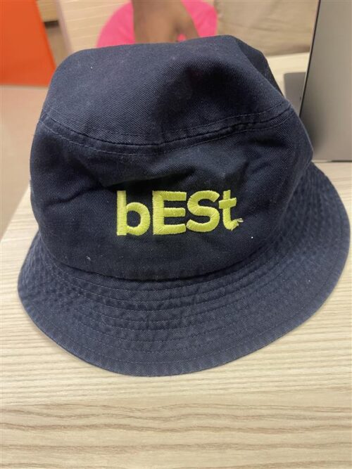 A navy blue bucket hat with "bESt" in yellow-green embroidery on the front, perfect for pairing with Environment Orientation Banana Pants (Copy) or showing off your eco-conscious style.