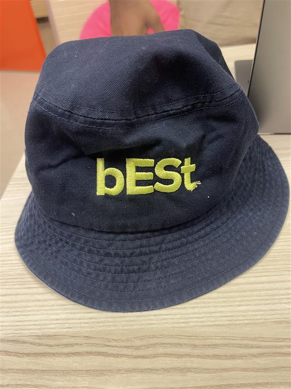 A navy blue bucket hat with "bESt" in yellow-green embroidery on the front, perfect for pairing with Environment Orientation Banana Pants (Copy) or showing off your eco-conscious style.