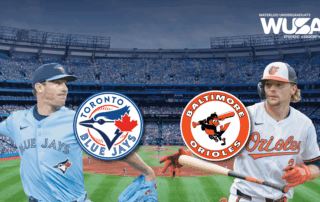 Two baseball players, one Toronto Blue Jay and one Baltimore Oriole, face off in a stadium adorned with team logos and WUSA branding on Game Night.
