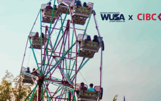 People enjoy a ride on the Ferris wheel at the carnival, with WUSA and CIBC logos shining against the clear sky—capturing the excitement of Sept 9.