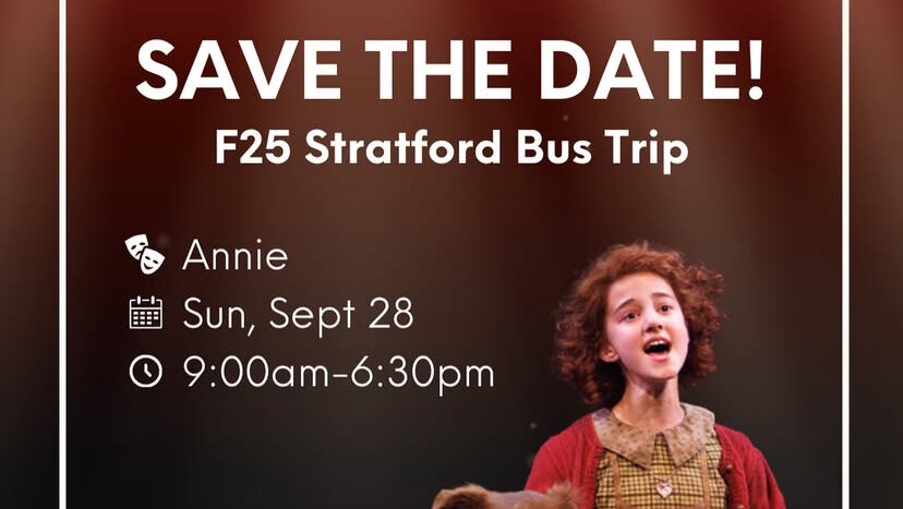 A girl in costume sits beside a brown and white dog on stage under red lights, promoting a Stratford bus trip.