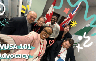 Six smiling people pose for a selfie in an office with flags and playful doodles. Text reads "WUSA 101 Advocacy".