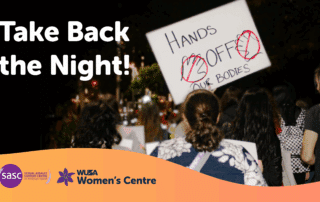 A crowd marches at night holding a sign reading "Hands off our bodies," uniting under the banner of Take Back the Night, with event logos shining in solidarity.