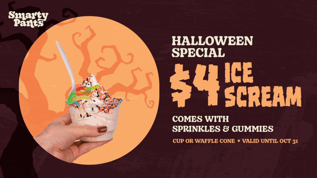 Hand holding ice cream with sprinkles and gummies; $4 Halloween special at Smarty Pants—treat yourself before this spooky deal melts away! Valid until Oct 31.