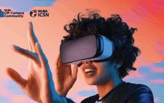 A person wearing a VRealm VR headset smiles and reaches forward, with colorful graphics in the background.