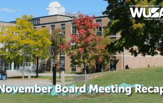 A campus building with autumn trees and text reading "November Board Meeting Recap.
