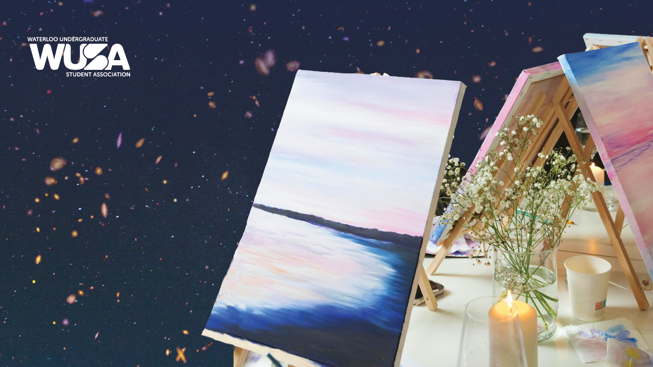 A canvas with a pastel landscape painting on an easel; flowers, candles, art supplies, and a Wine Not Paint glass set the scene for creativity.