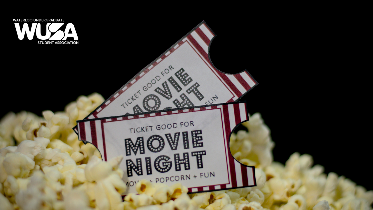 Two tickets rest atop a pile of popcorn, ready to kick off the perfect Movie Night.