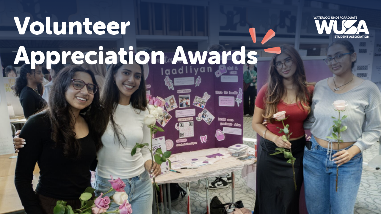 Volunteer Appreciation F25 Four people standing at a club booth.