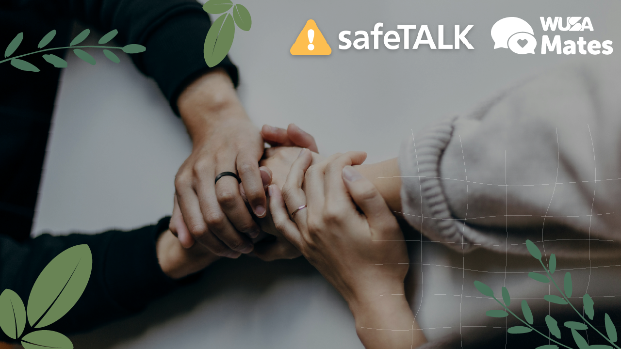 Four hands gently holding each other on a table, with safeTALK Training and WUSA Mates logos above.