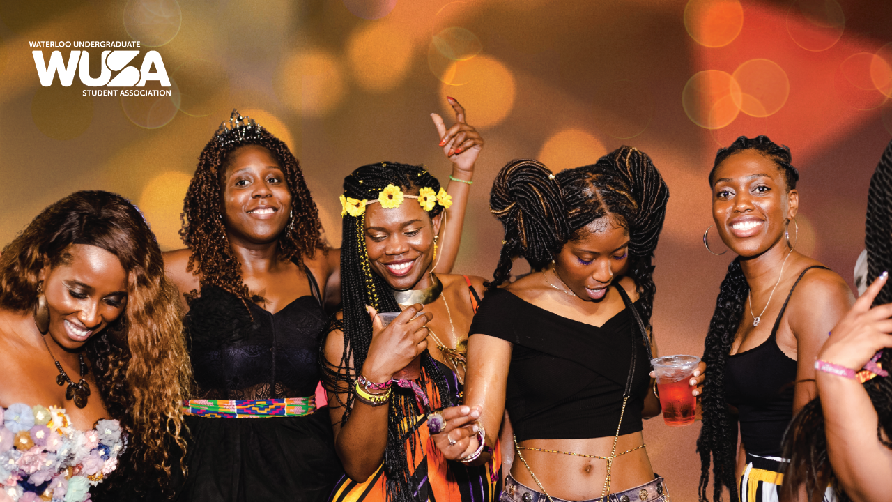 Five women smiling and dancing at a party; WUSA logo in the corner; bokeh lights in the background.
