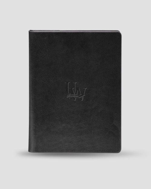 UW Aviation Society - License Holder: A closed black leather binder featuring a subtle embossed logo on the front, crafted as an elegant aviation license holder for UW Aviation Society members, displayed against a plain light background.