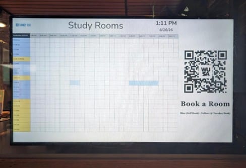 Digital schedule for study room bookings, with QR code and time slots—perfect for keeping track of Board Meeting reservations or sharing Meeting Recap details—shown on a large screen.